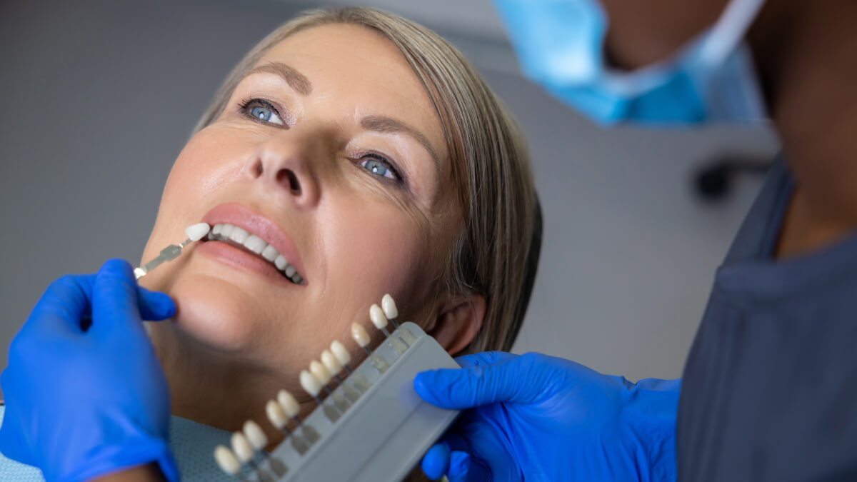 Dentist holding veneers